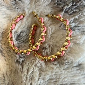Gold hoop earrings with pink accent